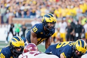 Michigan Wolverines quarterback Alex Orji (10) prepares for the snap as Michigan football hosts the University of Southern California at Michigan Stadium in Ann Arbor on Saturday, Sept. 21, 2024.